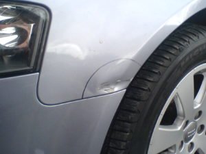 Car wing dent identified for insurance repair